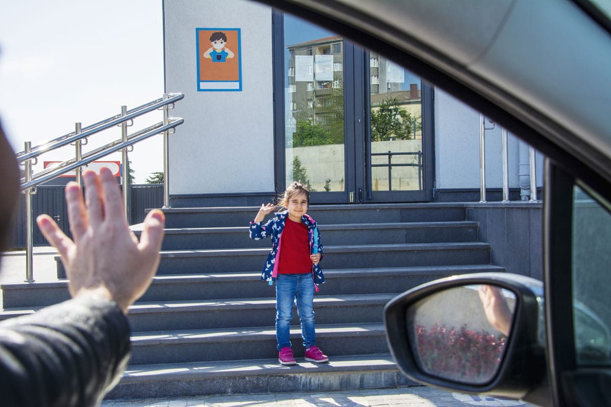 Kindergarten girl dropped off at a preschool & child care center Serving Smithfield, RI.